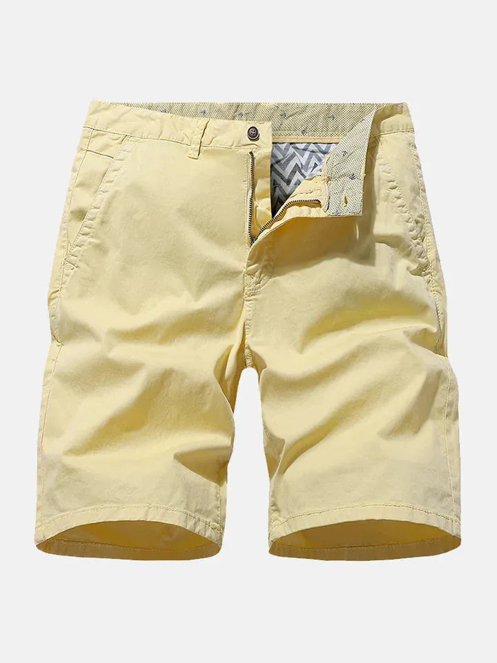 Man wearing blue printed denim casual shorts with an elastic waist and loose straight-leg fit