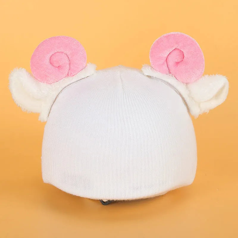 Soft plush cartoon character cover on a ski helmet for decoration.