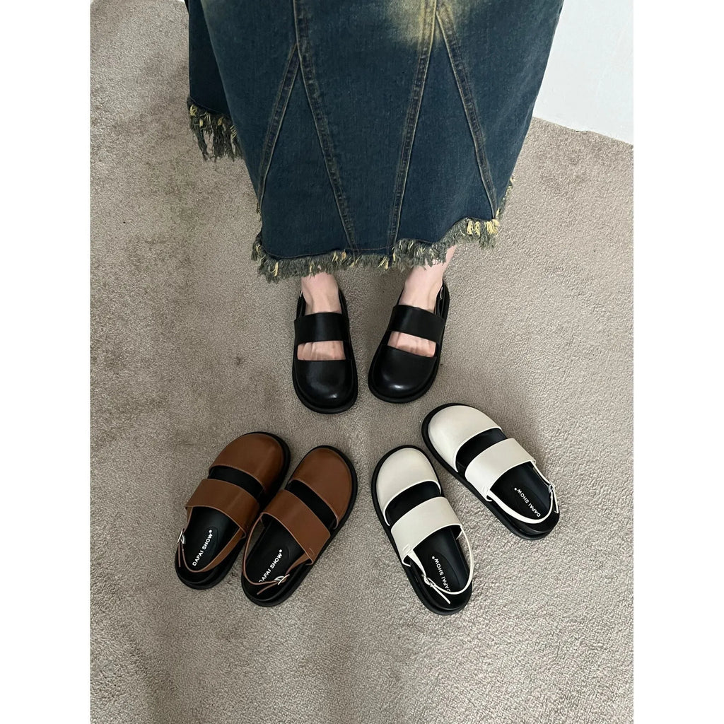Retro apricot women's sandals with a raised sole, closed toe, and an adjustable ankle strap buckle.