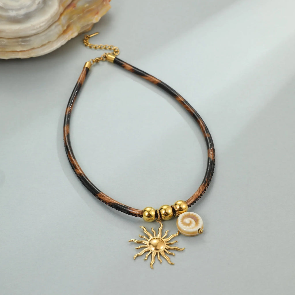 Leopard print geometric pendant on stainless steel necklace with gold-plated accents