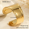 Women's stainless steel bracelet with 18K gold plating featuring geometric wave design and exaggerated wide band