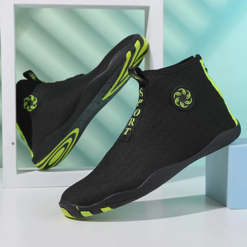 Casual mid-top outdoor beach shoes in black with coloured accents, showing mesh upper and rubber sole.