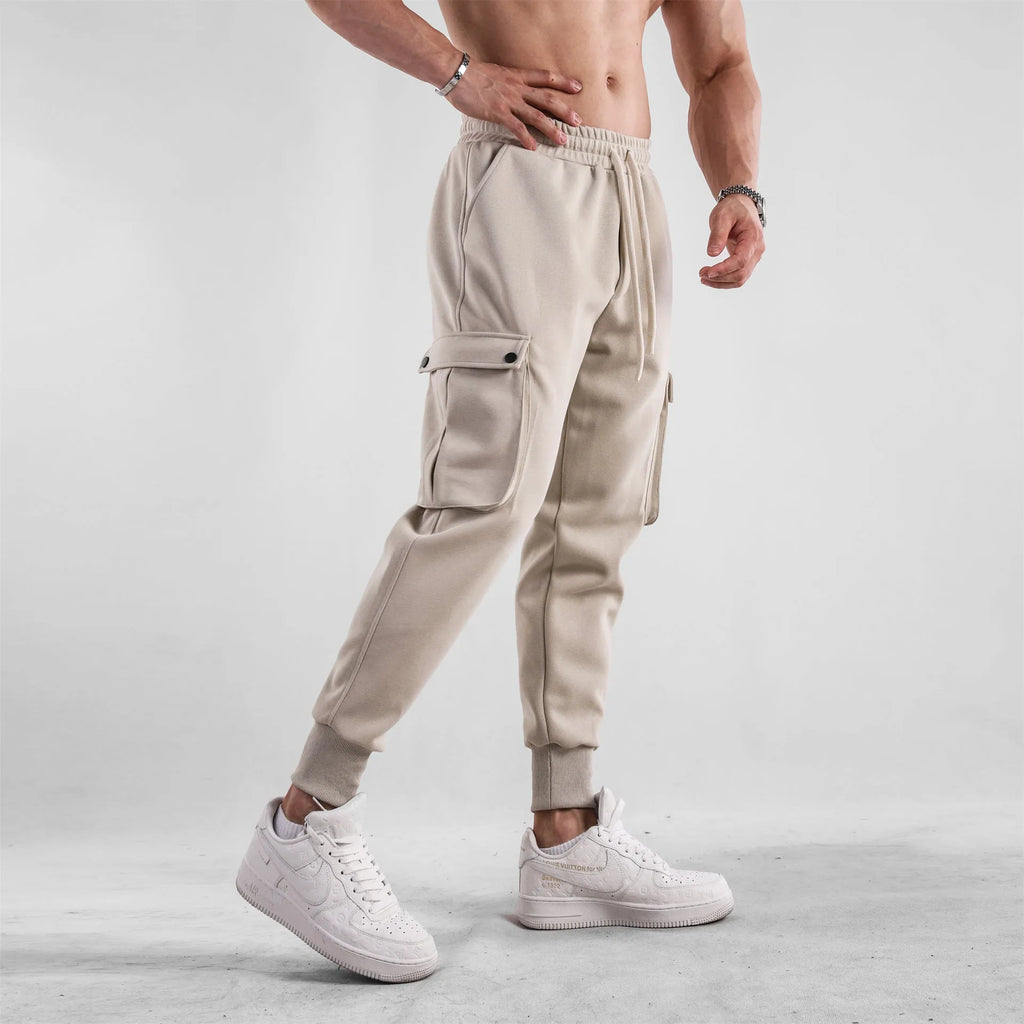 Men's loose cotton sports trousers with ankle-tied cuffs and multiple pockets in various colour options
