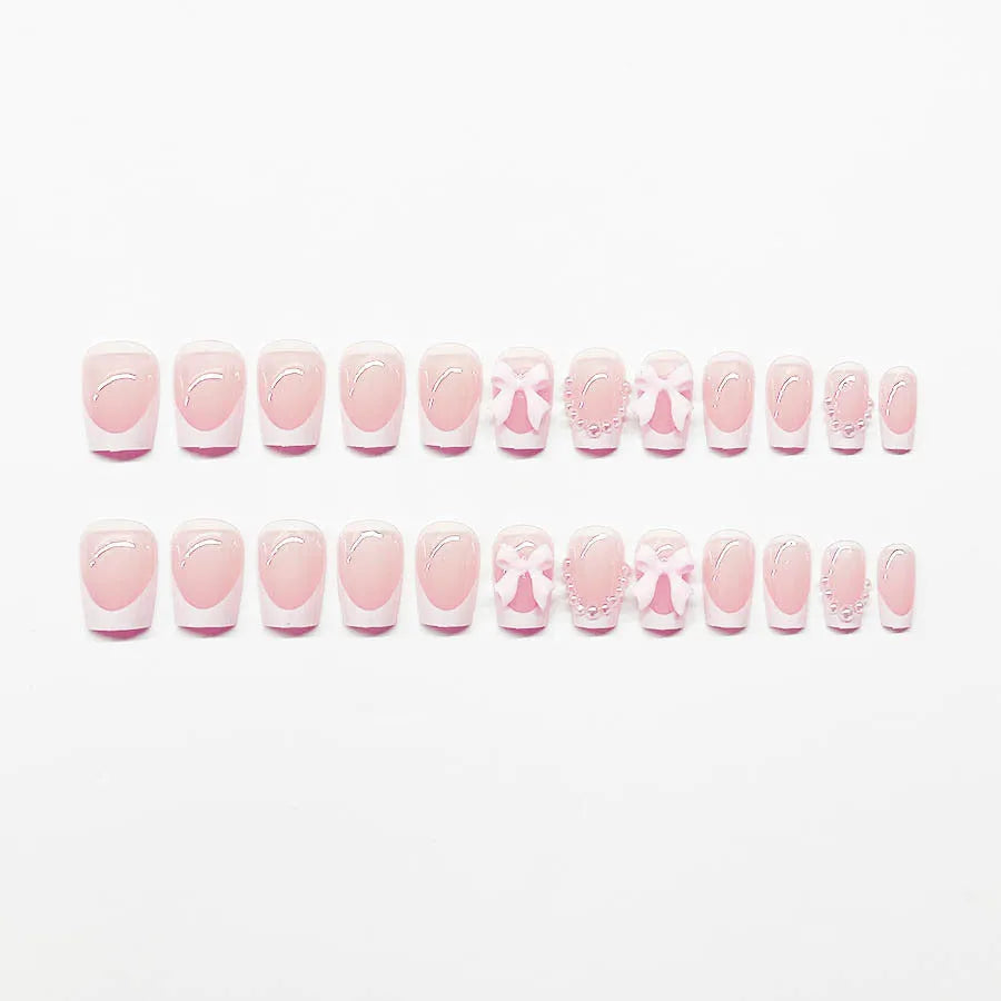 Short white French press-on nails with bow and tulip designs in European square shape