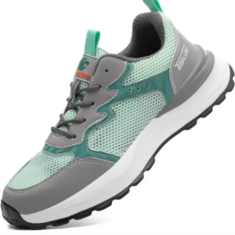 Green low-top work safety shoes with mesh panels and a plastic toe cap on a TPU sole.