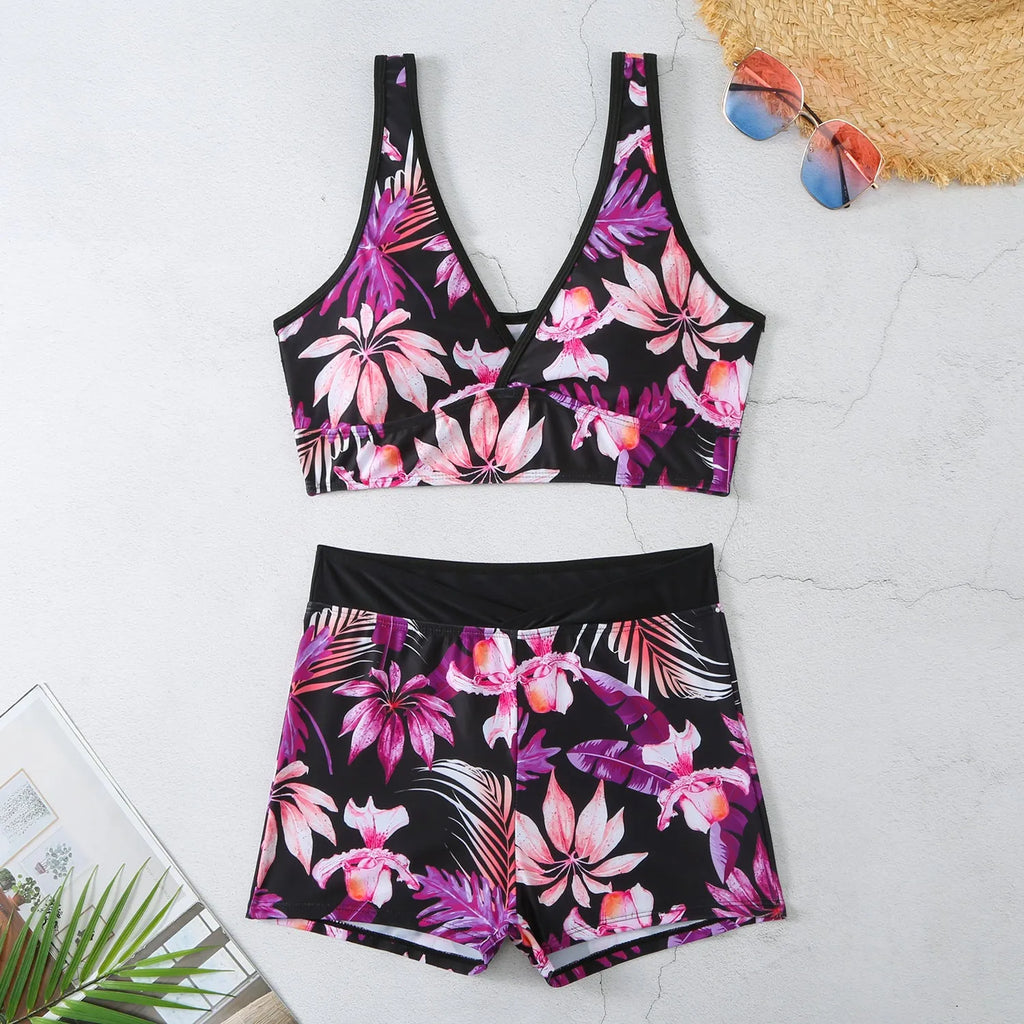 Women's two-piece printed boxer swimsuit set in a colourful style, showing sleeveless top and briefs.
