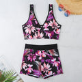 Women's two-piece printed boxer swimsuit set in a colourful style, showing sleeveless top and briefs.