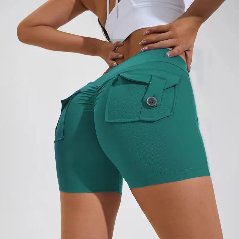 Women's high-waist fitness shorts in quick-dry nylon with side pockets, shown in Electric Blue.