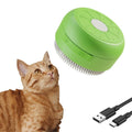 Rechargeable cat steam brush with green silicone bristles and ergonomic handle