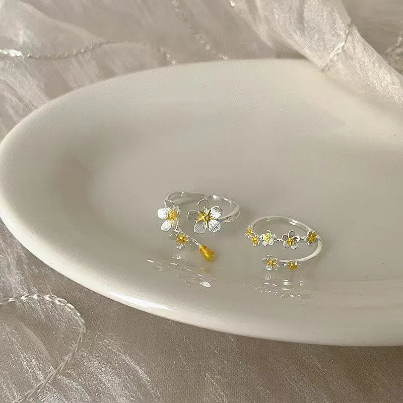 Adjustable open mouth ring with three-dimensional jasmine flower design and electroplated finish