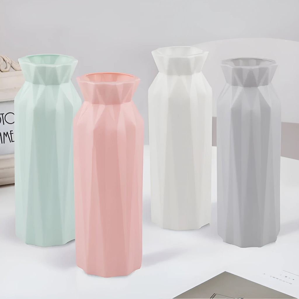 Simple green melamine plastic vase with a wide 7.2 cm base on a wooden table.