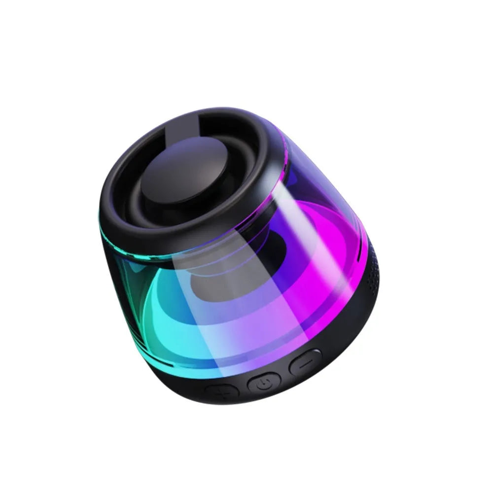 Black and white portable Bluetooth speaker with LED ambient lighting effects and magnetic base.