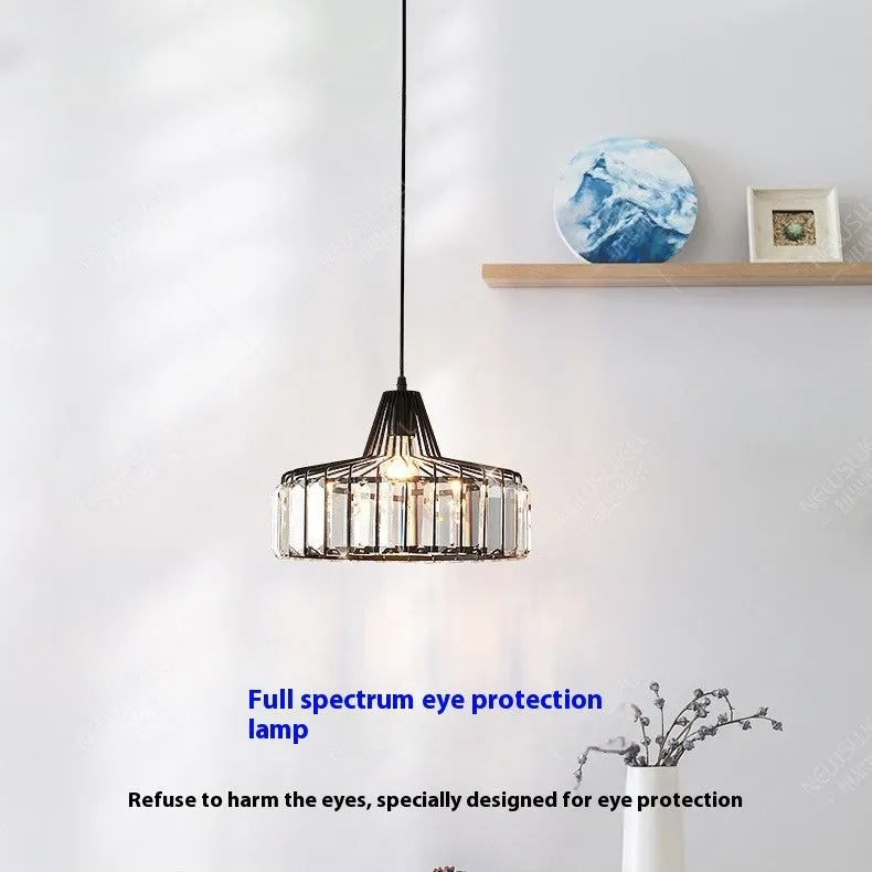 Modern black and crystal LED chandelier ceiling lamp with colour changing lights.
