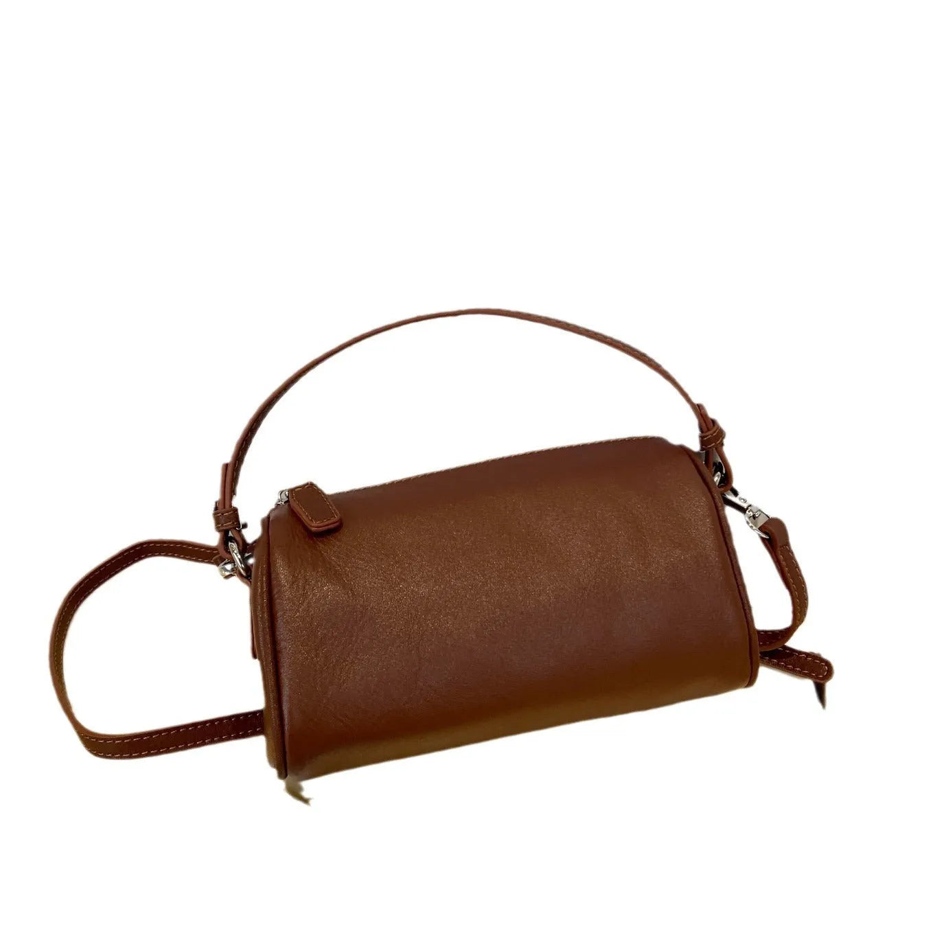 Men's cylindrical leather crossbody phone bag in black, shown with visible stitching and shoulder strap
