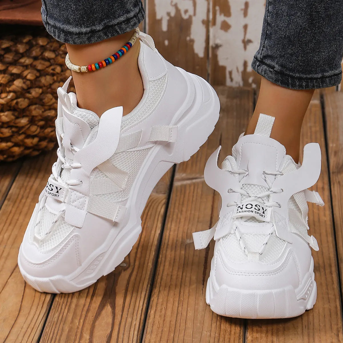 Women's purple platform mesh sports trainers with animal pattern and lace-up front on a white background.