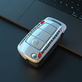 Carbon fibre style car key cover with mirror element in carbon black and white colours