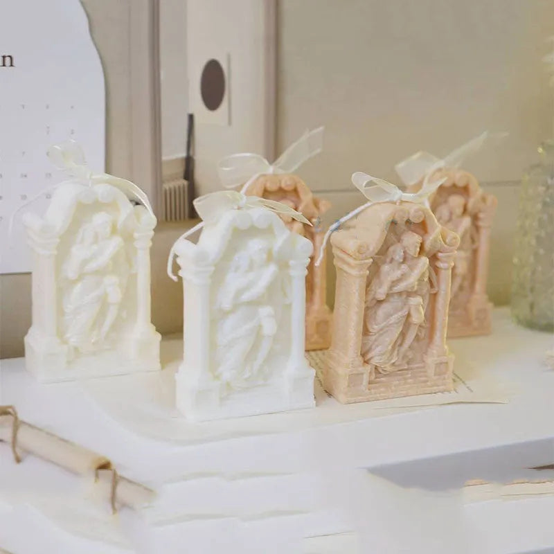 Flexible food grade silicone mold showing detailed Ancient Greek-style couple angel design for baking and crafts.