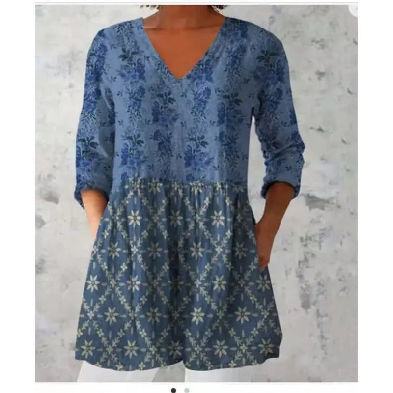 Women's loose-fitting printed dress with 3/4 sleeves and a wide waist design.