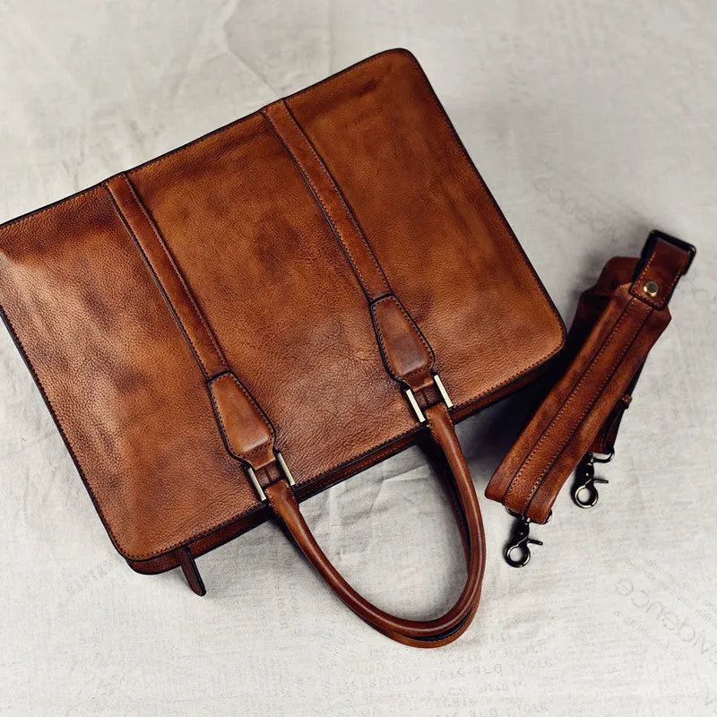 Men's brown leather business handbag with square horizontal shape and top zipper opening