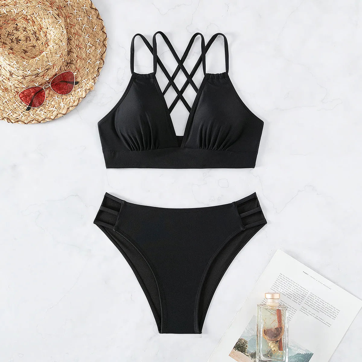 Women's black V-neck halter bikini with split-style bottoms on a mannequin.