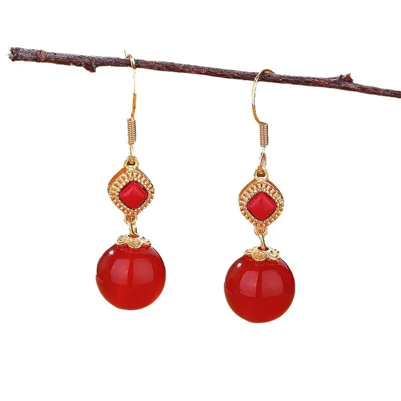 Geometric copper earrings with round red agate beads and silver jasper inlay.