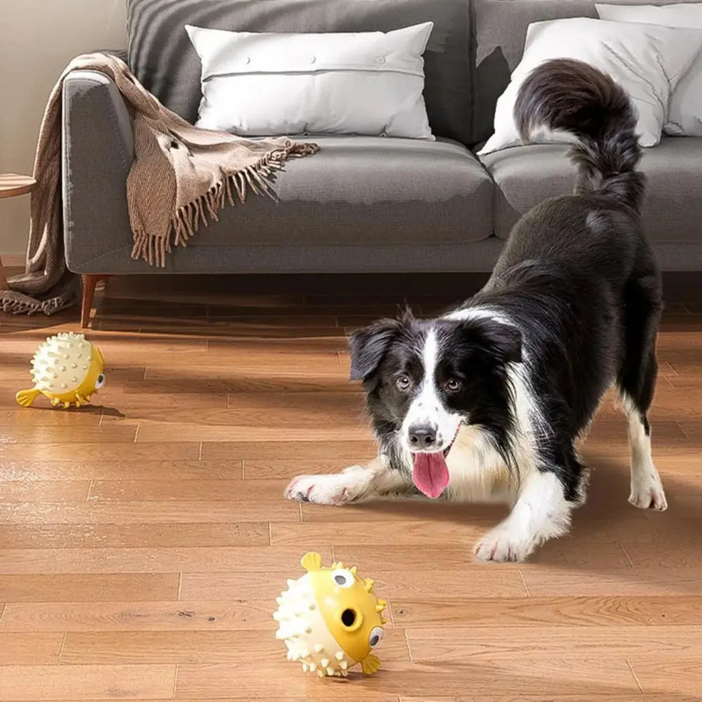 Yellow fish-shaped vinyl dog chew toy with textured surface for teeth cleaning