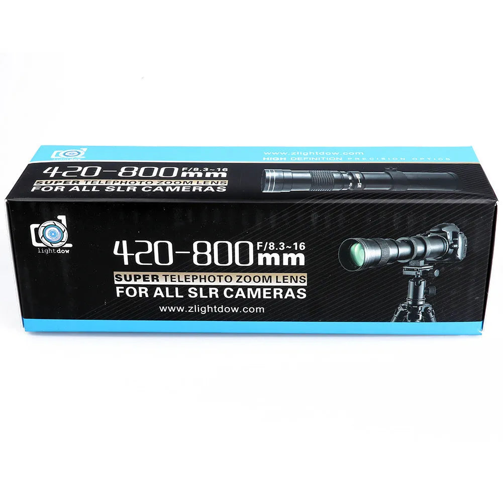 420-800mm manual telephoto zoom camera lens with T-mount adapter ring on a table