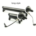 Black dog-shaped touch screen stylus pen shown next to a mobile phone on a desk.