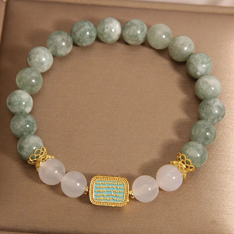 Women's crystal bracelet with oil green emerald stones and a scripture charm