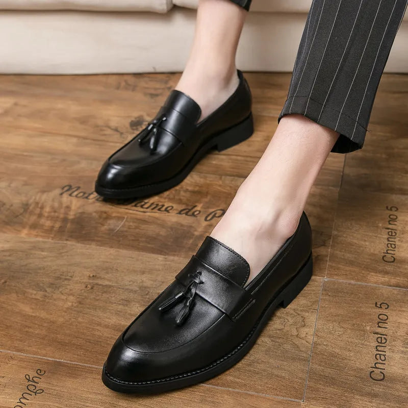 Men's black slip-on business casual shoes with tassel detail and rubber soles