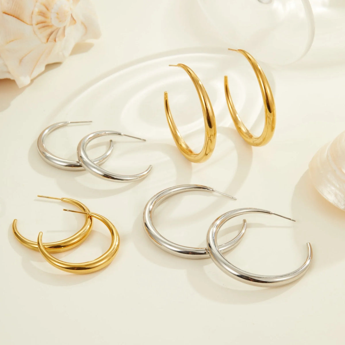 Titanium steel geometric circular hoop earrings with 18K gold plating in large or small sizes