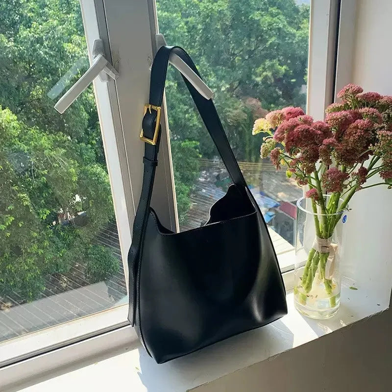Women's soft PU shoulder bag with swing threads detail in black or brown colour