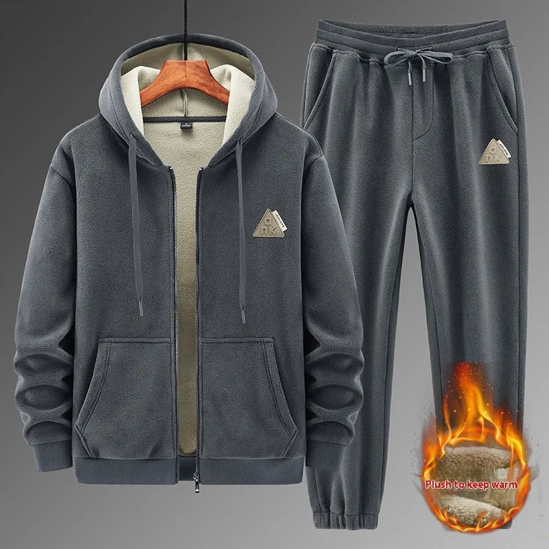 Grey men's hooded sweater and matching trousers casual sports suit set on a hanger.