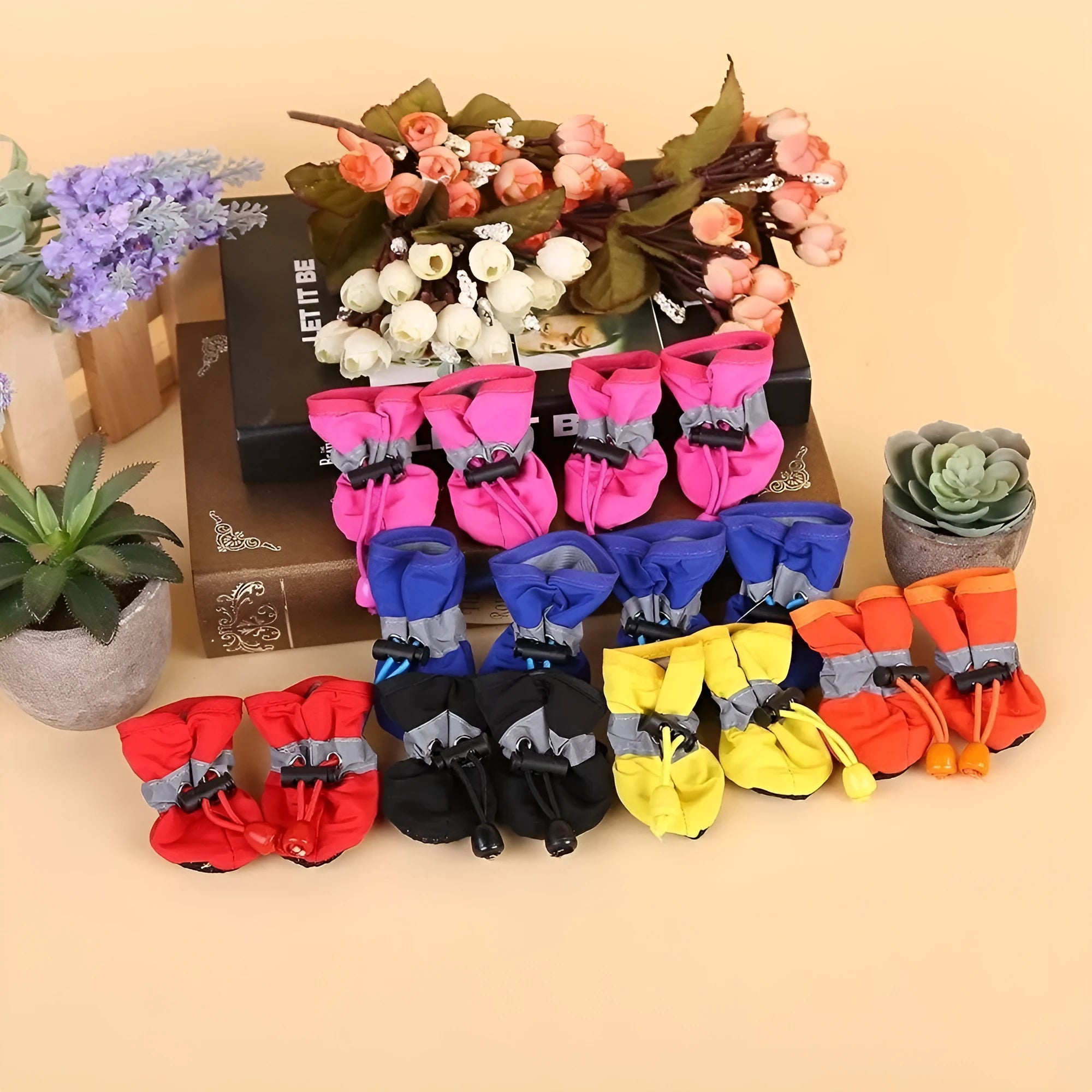 Cloth dog shoes with soft soles in multiple colours including red, black, blue, and monkey print designs