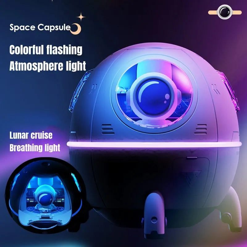 Purple astronaut-shaped USB desktop humidifier with LED lights on a desk