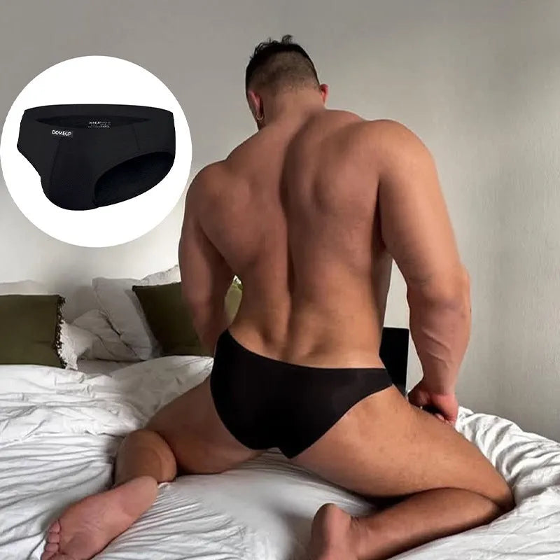 Men's solid colour low-waist briefs in white, black, or pink with seamless construction