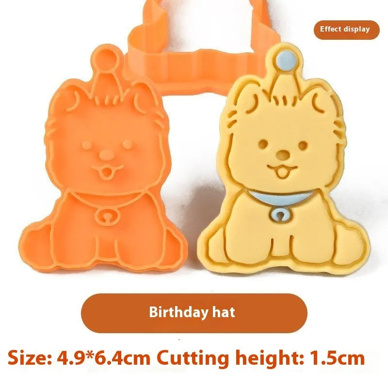 Plastic 3D biscuit mould with cartoon puppy designs including birthday hats and swimming rings