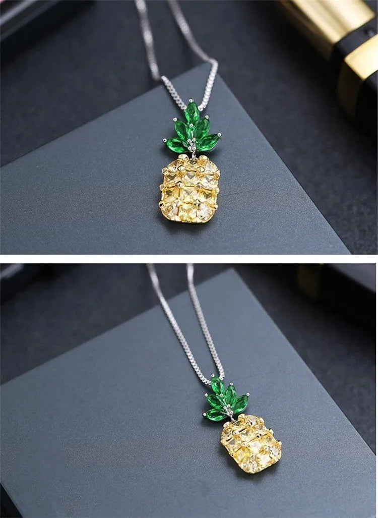 Silver plated women's necklace with a geometric pineapple diamond pendant charm.