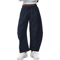 Loose cotton cropped sweatpants with drawstring waist in apricot colour showing street fashion styling