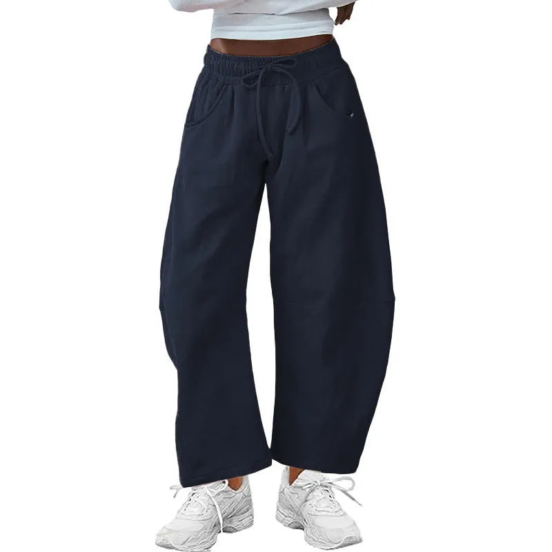 Loose cotton cropped sweatpants with drawstring waist in apricot colour showing street fashion styling