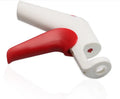 Stainless steel cherry pitter kitchen gadget with soft grip handles for removing stones from fruit.