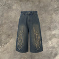 Men's black denim shorts with flame embroidery detail on straight-leg cut