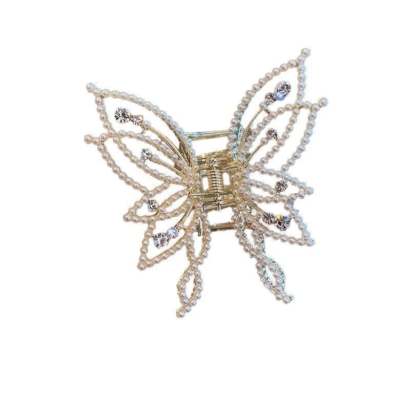 Butterfly-shaped alloy hair clip barrette for women, available in rhinestone and pearl styles.
