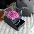 Glass eternal flower jewellery box with preserved roses and carnations inside measuring 8.5cm square
