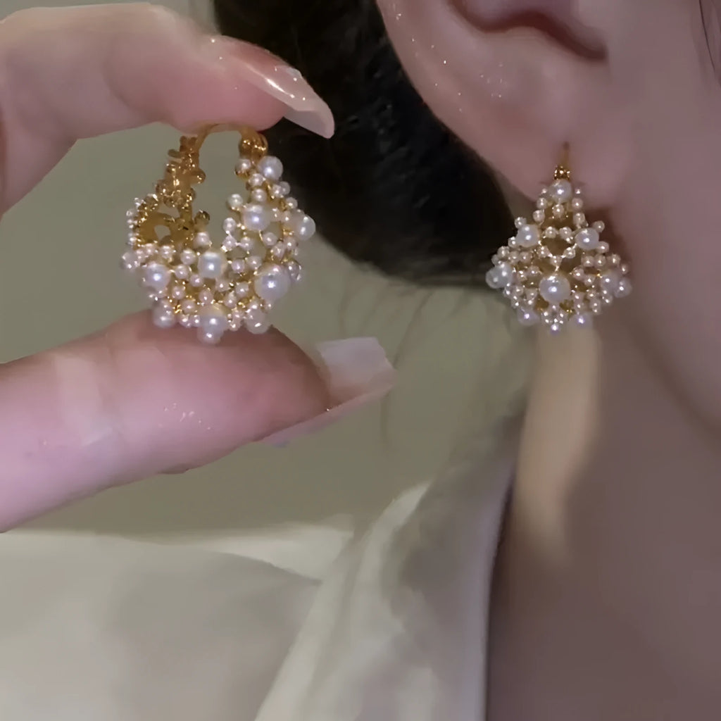 Gold copper flower basket earrings with small rice-shaped beads and pearl inlay detail