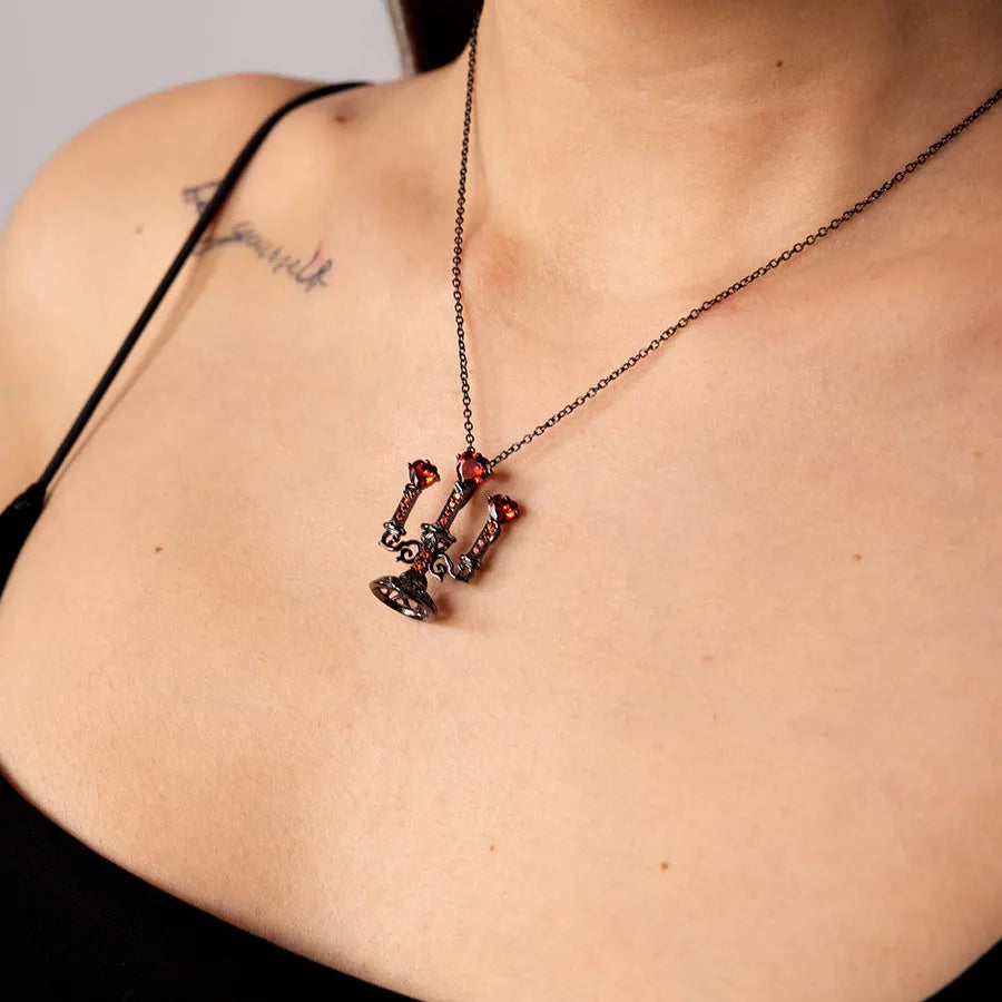 Gothic hollow candlestick pendant necklace on a cross chain in retro candlestick colour.