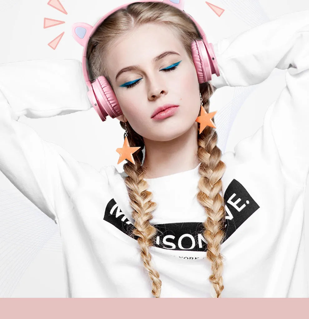 Pink and white wireless Bluetooth headset with over-ear design and 40mm speakers