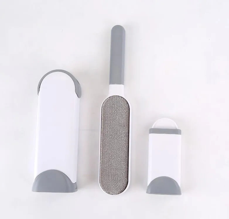 Blue reusable pet hair removal brush with double-sided sticky head placed on its self-cleaning base.