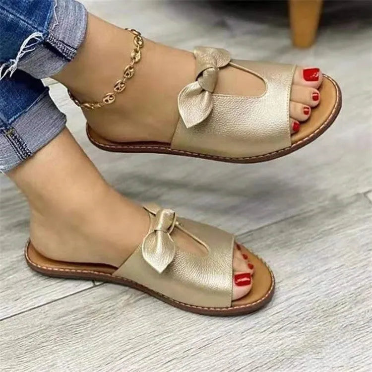 Ladies black fish mouth sandals with a bow detail on the strap.