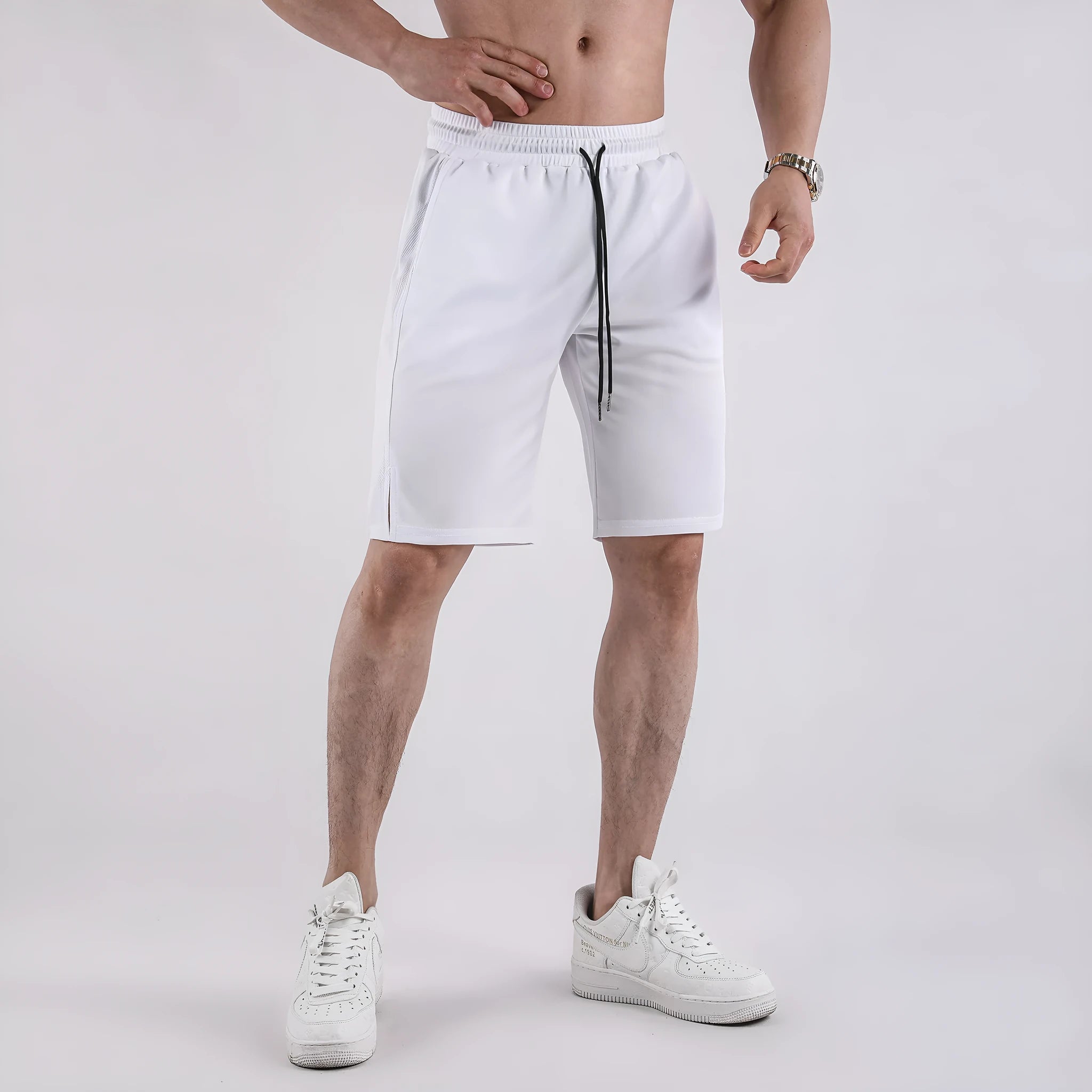 Men's black mesh capri shorts with elastic waistband and loose fit design